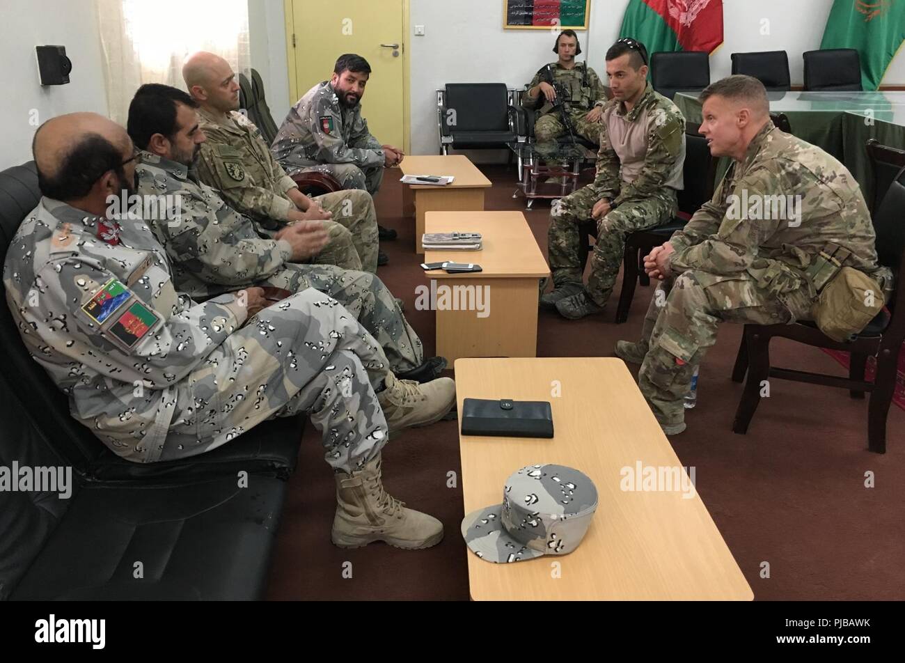 ZABUL PROVINCE, Afghanistan (July 02, 2018) -- Brig. Gen. Mirwais Noorzai, Provincial Chief of Police, Zabul province, along with two of his officers meet with advisors from the NATO-led Resolute Support Security Forces Assistance Brigade at the Afghan 205th Corps, 2nd Brigade Headquarters. The Afghan National Army is working closely with the Afghan National Police in the Afghan-led offensive operations in the south. (NATO Stock Photo