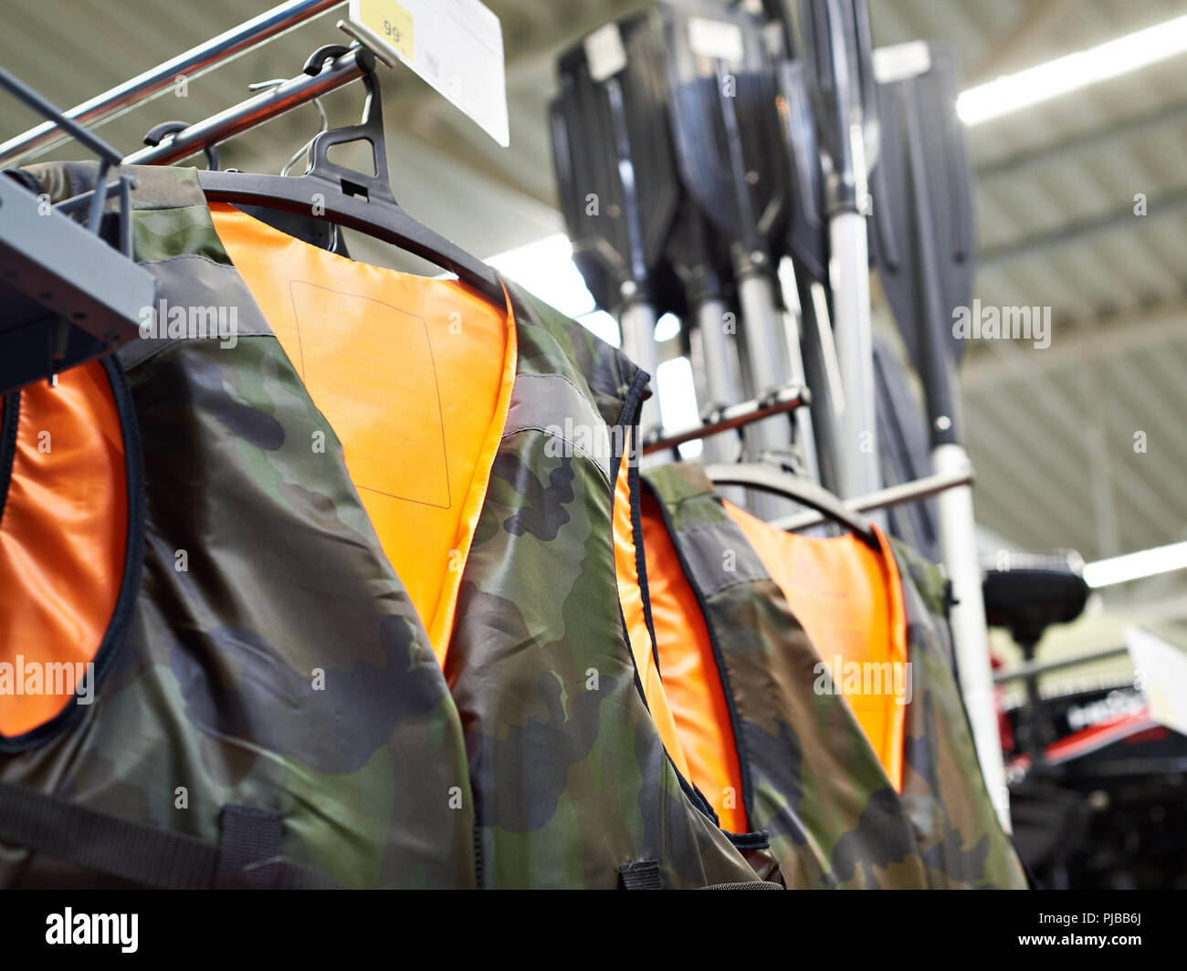 Life jackets for fishing in the sports store Stock Photo