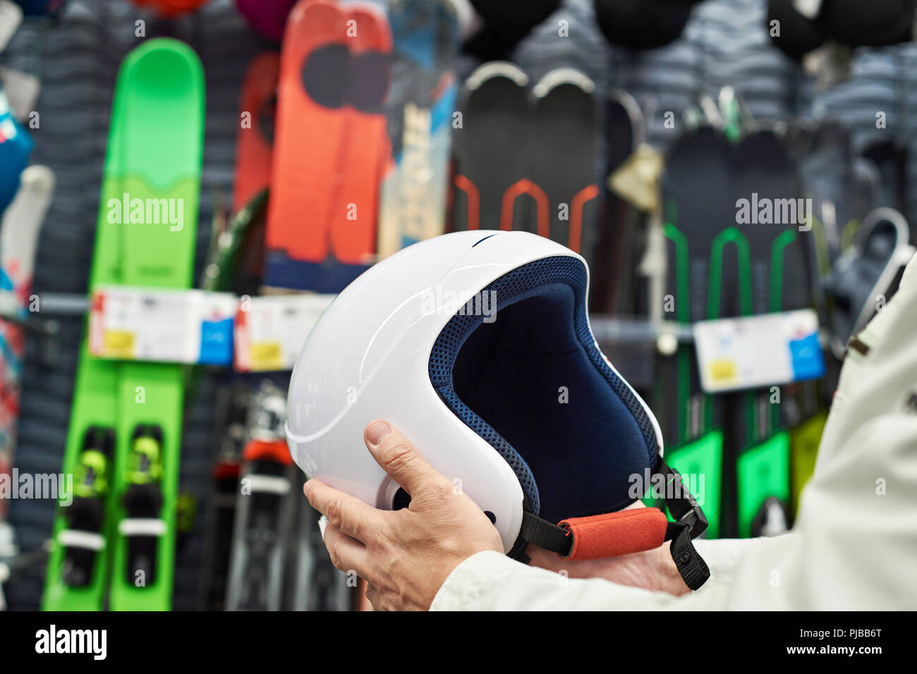 Protective sports helmet for skiing in the hands of men Stock Photo