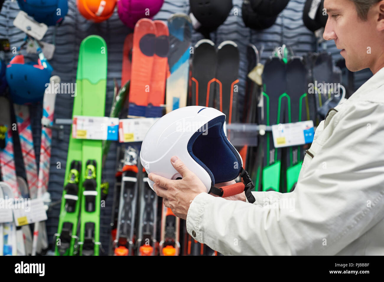 Protective sports helmet for skiing in the hands of men Stock Photo