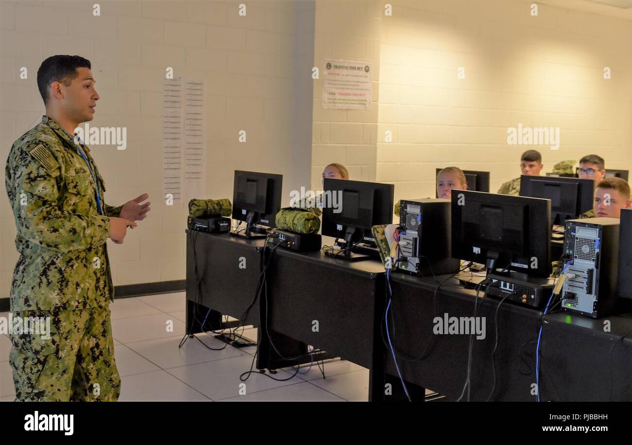 Fla. (July 2, 2018) Information Systems Technician 1st Class Samuel Garcia, a native of El Paso, Texas, instructs new accession Sailors in the Information Systems Technician “A” School at Information Warfare Training Command (IWTC) Corry Station. As part of the Center for Information Warfare Training, IWTC Corry Station delivers trained information warfare professionals to the Navy and joint services, enabling optimal performance of information warfare across the full spectrum of military operations. Stock Photo