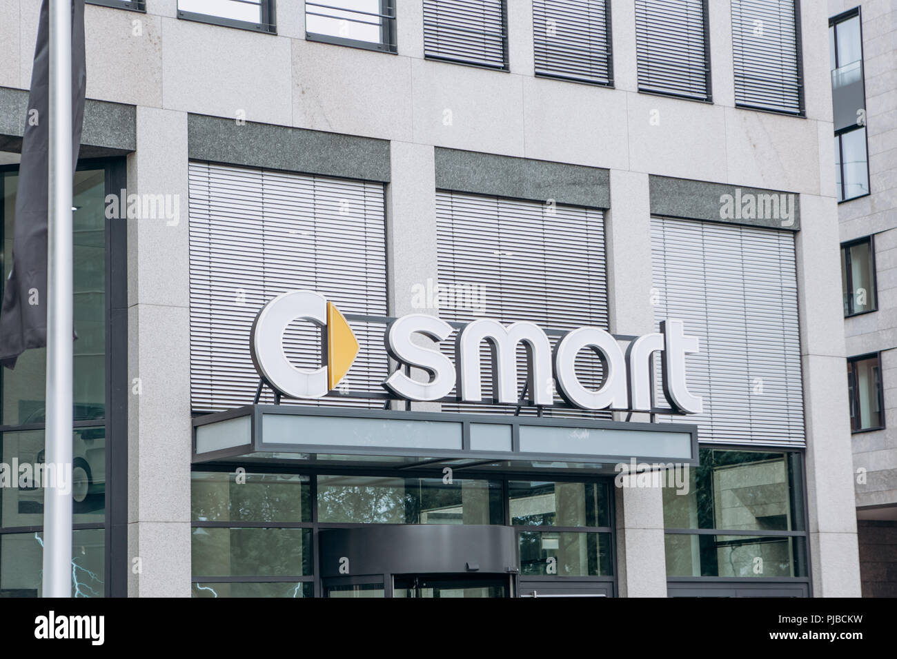 Berlin, August 29, 2018: Signboard at the entrance to the central office in Berlin of the company Smart manufacturing cars of economy class. Stock Photo