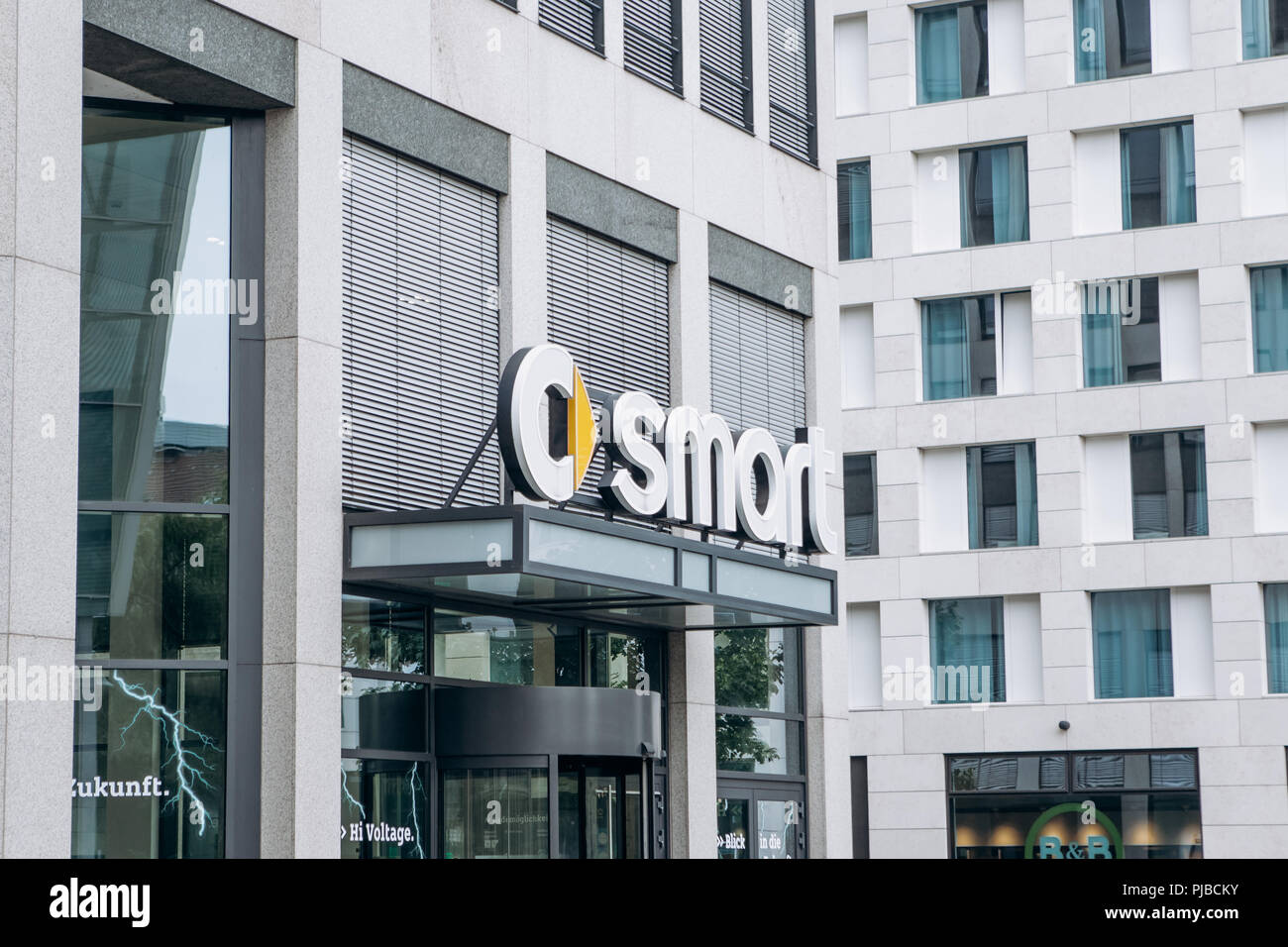 Berlin, August 29, 2018: Signboard at the entrance to the central office in Berlin of the company Smart manufacturing cars of economy class. Stock Photo