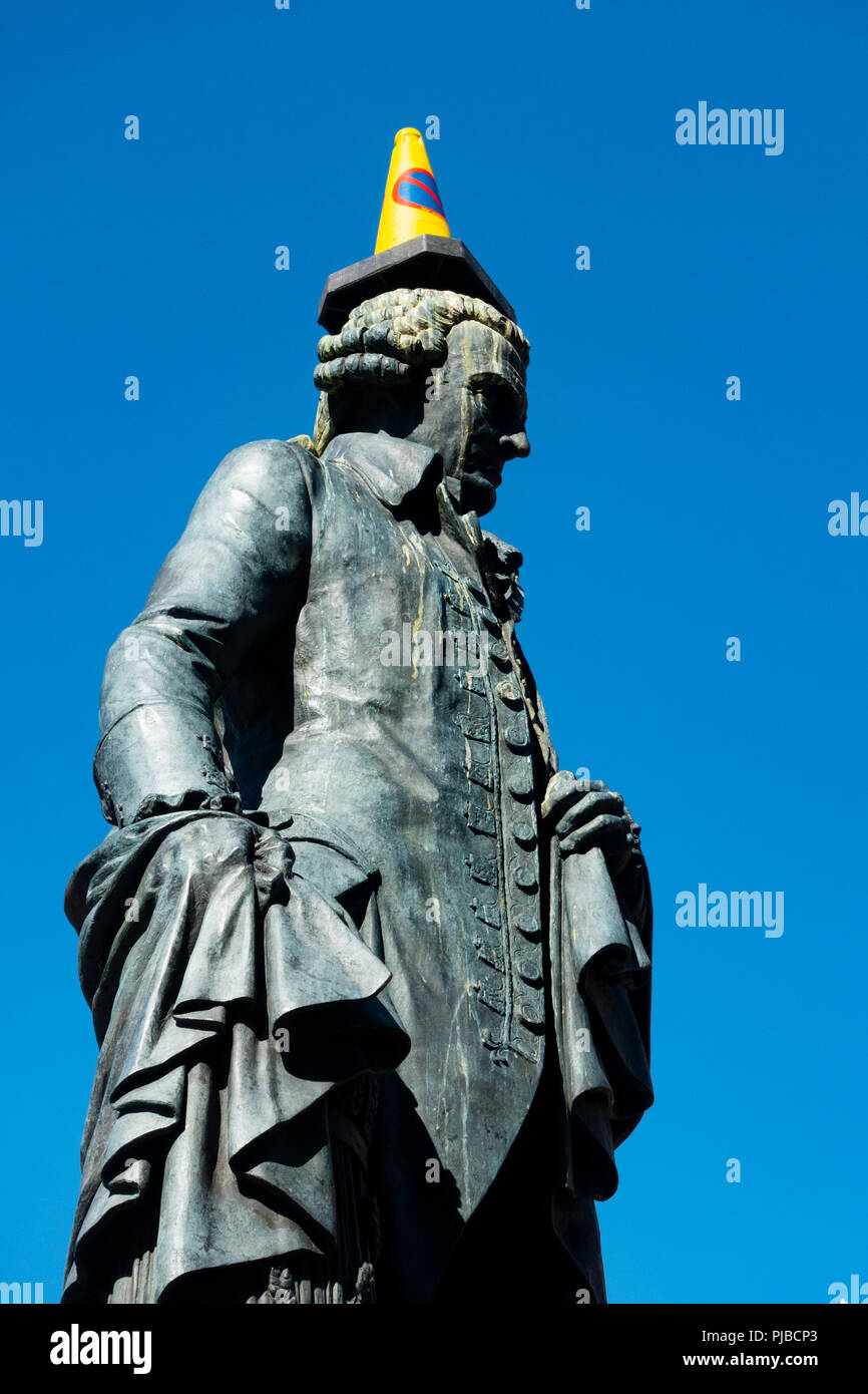 Statue of Adam Smith with traffic cone on head on Royal Mile in