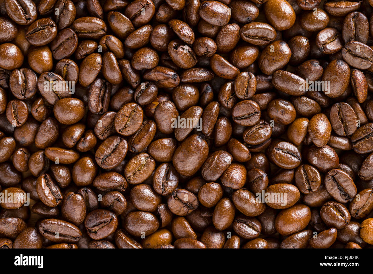 Pattern of roasted coffee beans. Texture. Stock Photo