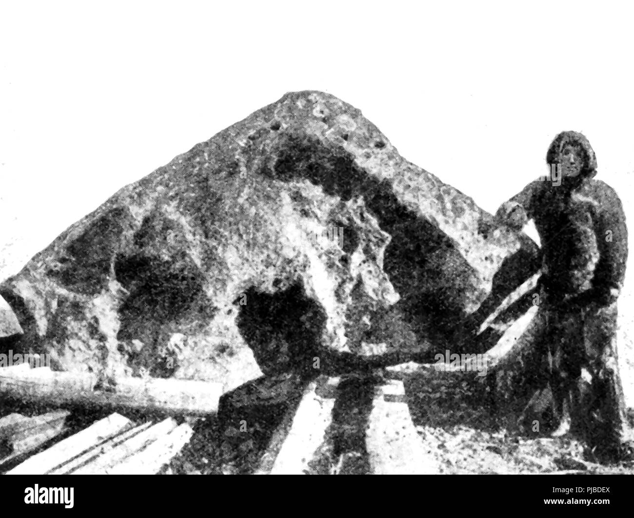 A 1920 news picture showing a giant meteor (The Cape York meteorite)discovered by Commander Peary in Greenland.- Better known as Rear Admiral Robert Edwin Peary  the   American explorer and US Navy officer who claimed to have reached the geographic North Pole with his expedition on April 6, 1909. Stock Photo