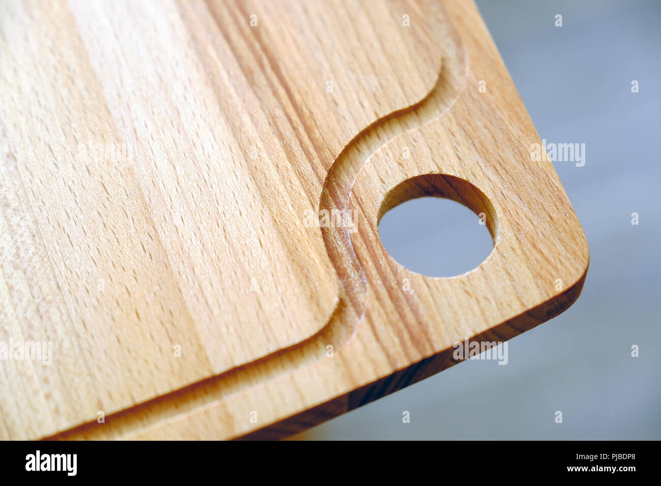 Cutting board. Hanging hole in the kitchen after use Stock Photo Alamy