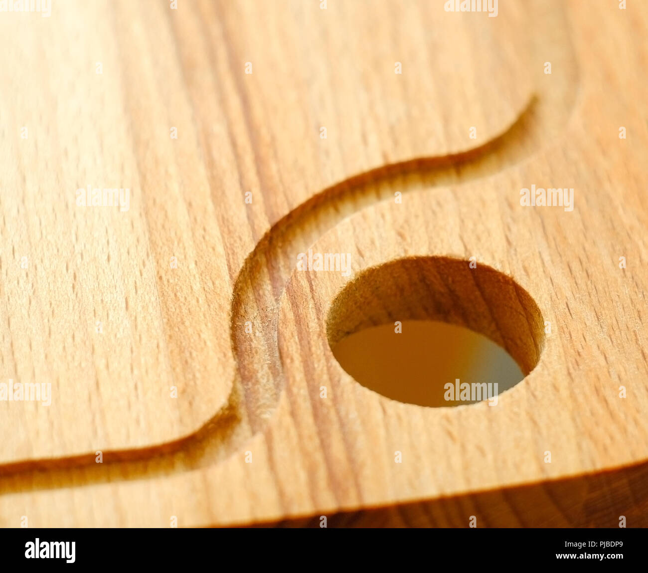 Cutting board. Hanging hole in the kitchen after use Stock Photo Alamy