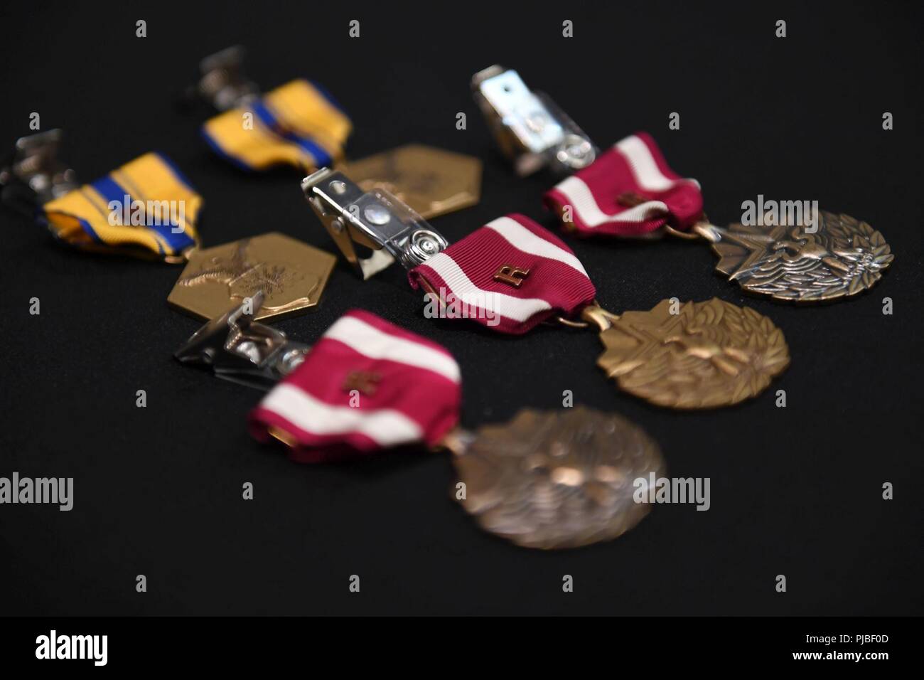 U.S. Air Force decoration medals sit on a table during the remote “R