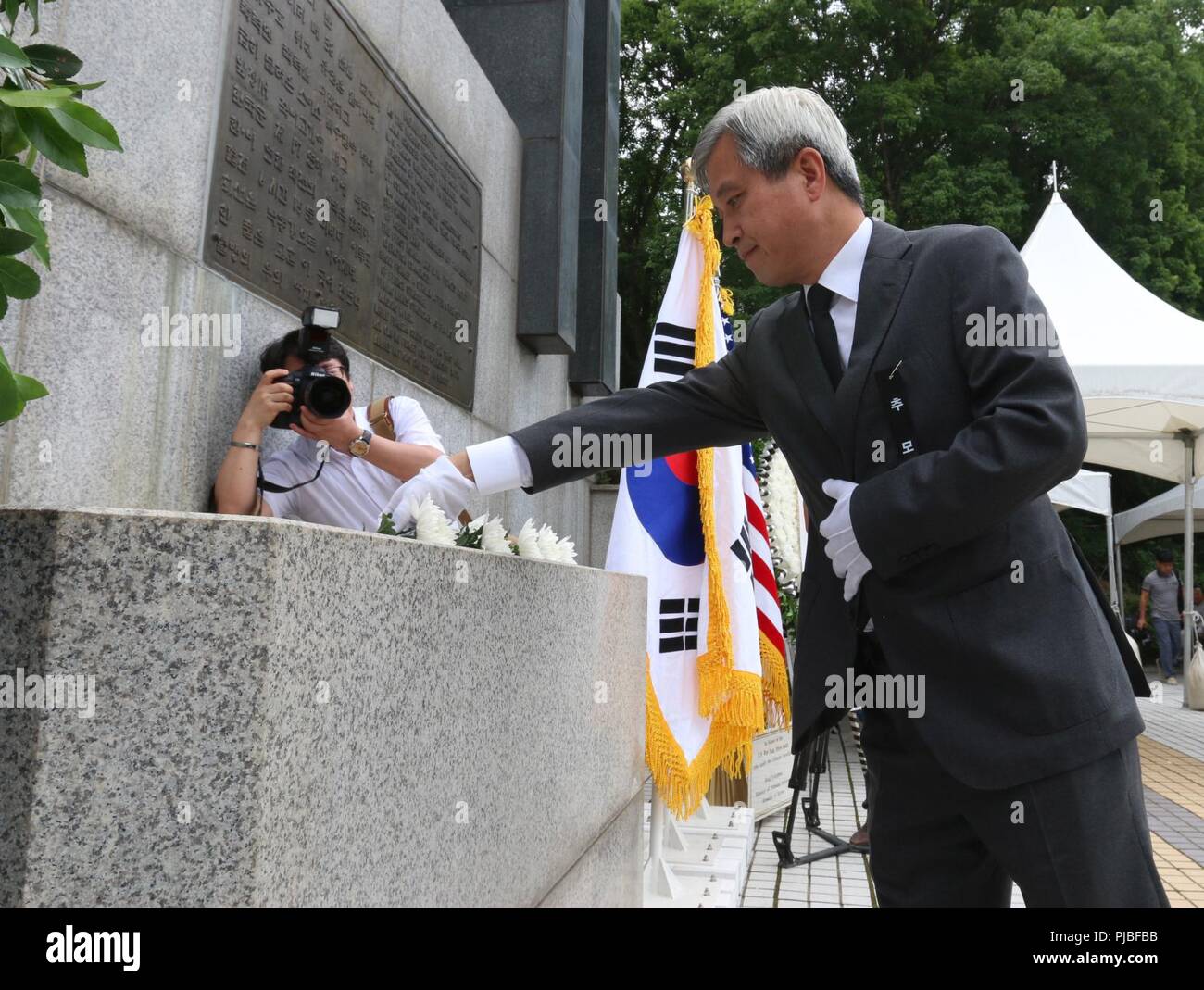 OSAN, Republic of Korea - Osan City Mayor Kwak Sang-Wook places a ...