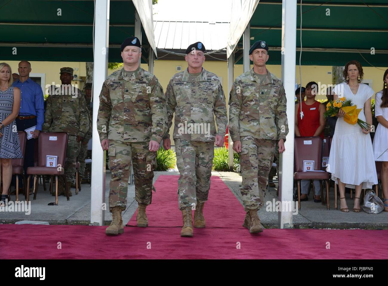 U.S. Army Africa, Brig. Gen. Eugene J. LeBoeuf, the U.S. Army Africa acting commanding general (center), Lt. Col. Marcus S. Hunter, Incoming Battalion Commander, Headquarters and Headquarters Battalion, U.S. Army Africa (left) and Lt. Col. Brett M. Medlin, outgoing Battalion Commander, Headquarters and Headquarters Battalion (right), arrive for a change of command ceremony at Caserma Ederle in Vicenza, Italy, July 12, 2018. Stock Photo