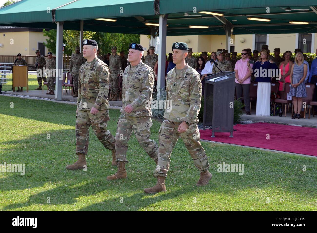 U.S. Army Africa, Brig. Gen. Eugene J. LeBoeuf, the U.S. Army Africa acting commanding general (center), Lt. Col. Marcus S. Hunter, Incoming Battalion Commander, Headquarters and Headquarters Battalion, U.S. Army Africa (left) and Lt. Col. Brett M. Medlin, outgoing Battalion Commander, Headquarters and Headquarters Battalion (right), prepare for the change of command ceremony at Caserma Ederle in Vicenza, Italy, July 12, 2018. Stock Photo
