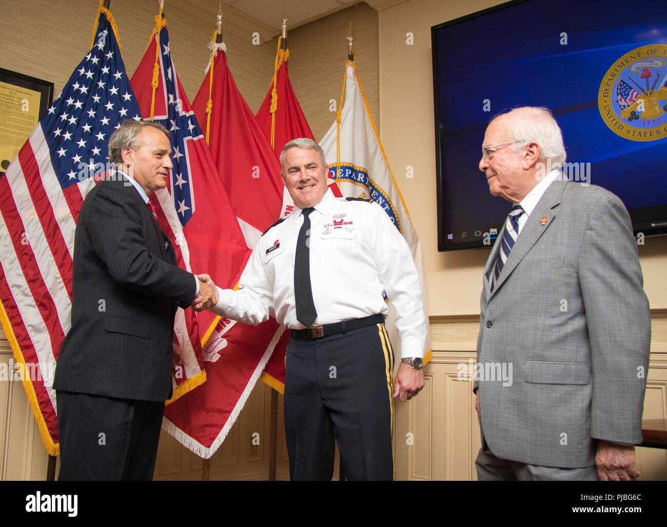 Mississippi River Commission President Maj. Gen. Richard Kaiser and Sam Angel, the MRC's longest standing member, congratulate James A. Reeder after his swearing in at the MRC headquarters in Vicksburg, Miss., July 11, 2018. President Donald Trump appointed Reeder as a member of the Mississippi River Commission May 17, 2018. Commission appointments are nominated by the President of the United States and vetted by the U.S. Senate. (USACE Stock Photo