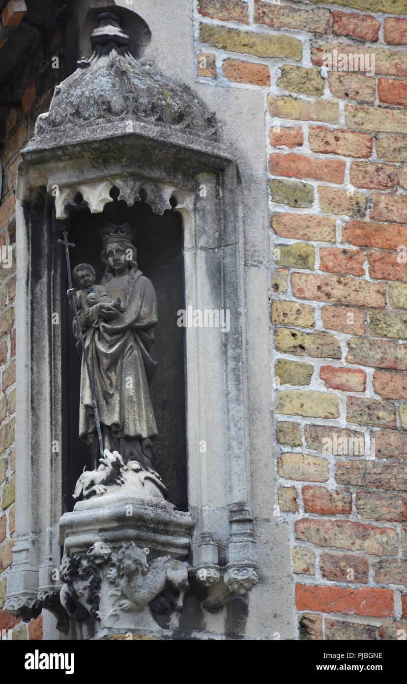 Statue in alcove on wall Stock Photo