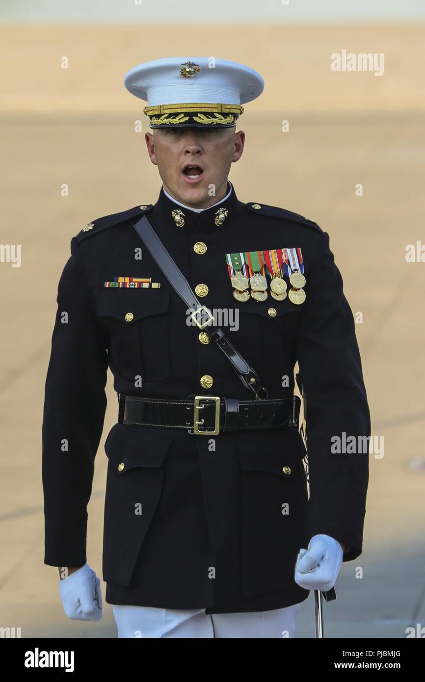 Major Russell Fluker, parade adjutant, Marine Barracks Washington D.C., calls a command during a Tuesday Sunset Parade at the Lincoln Memorial, Washington D.C., July 10, 2018. The guest of honor for the parade was the former Vice President of the U.S., Joe Biden, and the hosting official was the Staff Judge Advocate to the Commandant of the Marine Corps, Maj. Gen. John R. Ewers Jr. Stock Photo