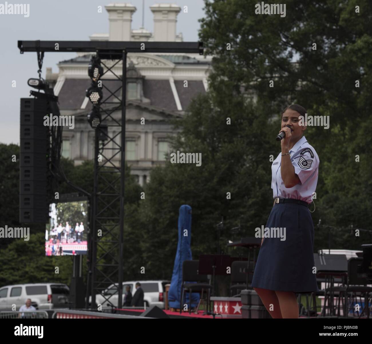 Tech. Sgt. Nalani Quintello, U.S. Air Force Band Max Impact vocalist, performs at the White House in Washington, D.C., July 4, 2018. Max Impact performed for audience members on Independence Day to honor veterans and inspire patriotism. Stock Photo