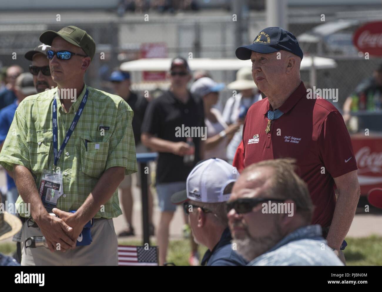Retired Army Staff Sgt. Don Jenkins, a Medal of Honor recipient, watches as Max Impact performs at Daytona International Speedway in Daytona Beach, Fla., July 7, 2018. Max Impact performed for the Coca-Cola Firecracker 250 and the Coke Zero Sugar 400, showcasing Air Force excellence to tens of thousands of attendees. Stock Photo
