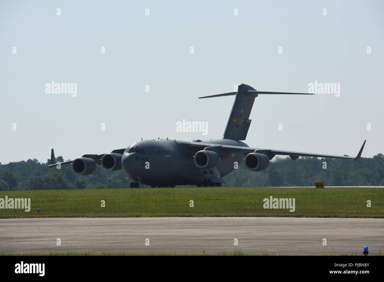U.S. Airmen of the 169th Fighter Wing of the South Carolina Air National Guard at McEntire Joint National Guard Base, South Carolina, depart in a U.S. Air Force C-17 Globemaster III large transport aircraft from Joint Base Charleston, South Carolina, July 11, 2018. The South Carolina Air National Guard’s 169th Fighter Wing is deploying nearly 300 Airmen and approximately a dozen F-16 Block 52 Fighting Falcon fighter jets to the 407th Air Expeditionary Group in Southwest Asia in support of an Air Expeditionary Force rotation. Stock Photo