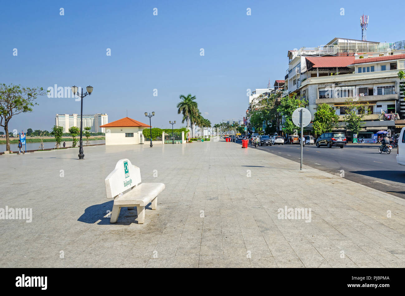 Phnom Penh, Cambodia - April 9, 2018: Preah Sisowath Quay, a riverside public promenade on the bank of the Tonle Sap River with its  large, long open  Stock Photo