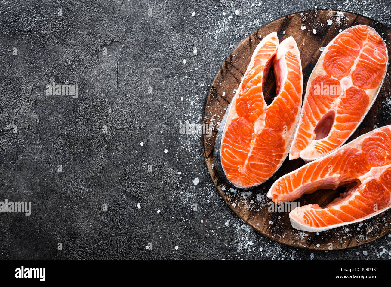 Raw salmon fish. Fresh salmon steaks Stock Photo - Alamy