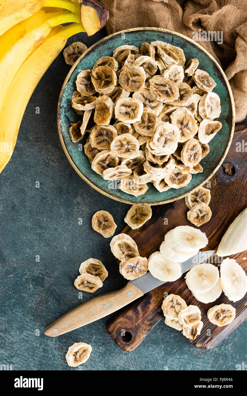 Dried banana chips and fresh bananas Stock Photo Alamy