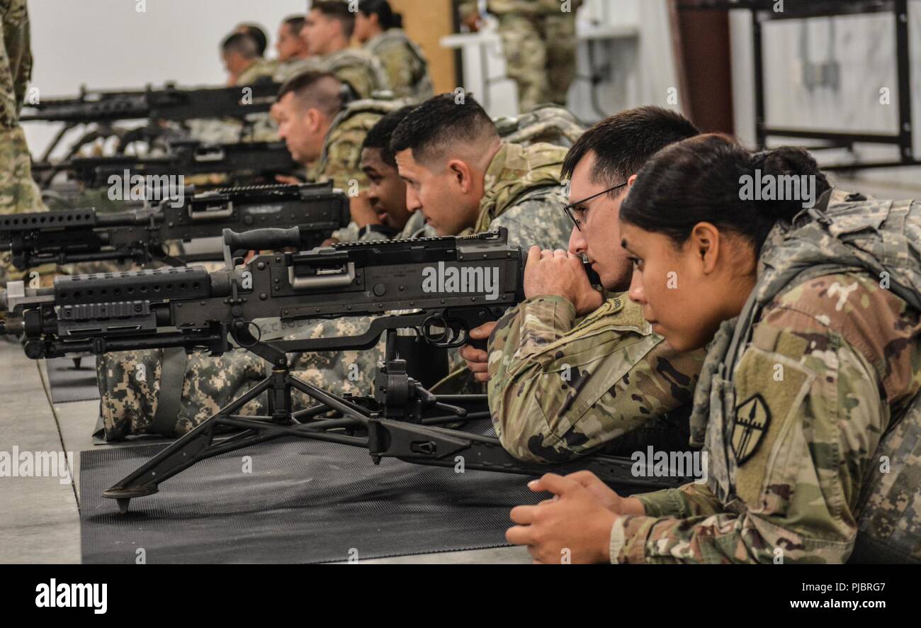U.S. Army Reserve Troop List Unit Soldiers practice binding an M240B machine gun during Operation Cold Steel II, July 10, 2018 at Joint Base McGuire-Dix-Lakehurst, N.J. Operation Cold Steel is the U.S. Army Reserve’s crew-served weapons qualification and validation exercise to ensure America’s Army Reserve units and Soldiers are trained and ready to deploy on short notice as part of Ready Force X and bring combat-ready and lethal firepower in support of the Army and our joint partners anywhere in the world. Stock Photo