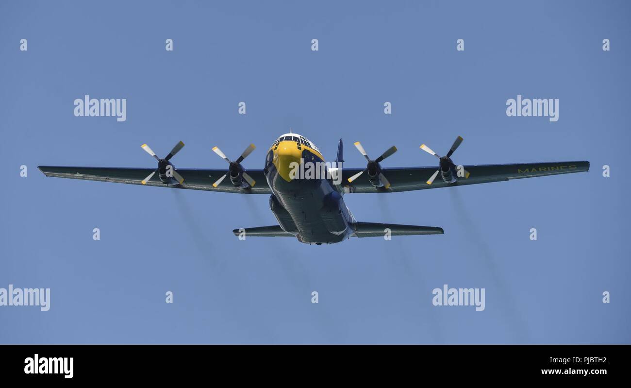 PENSACOLA BEACH, Fla. (July 13, 2018)   The U.S. Navy Flight Demonstration Squadron, the Blue Angels' C-130, Fat Albert, passes in front of the crowd at the 2018 Pensacola Beach Air Show. The Blue Angels are scheduled to perform more than 60 demonstrations at more than 30 locations across the U.S. and Canada in 2018. Stock Photo