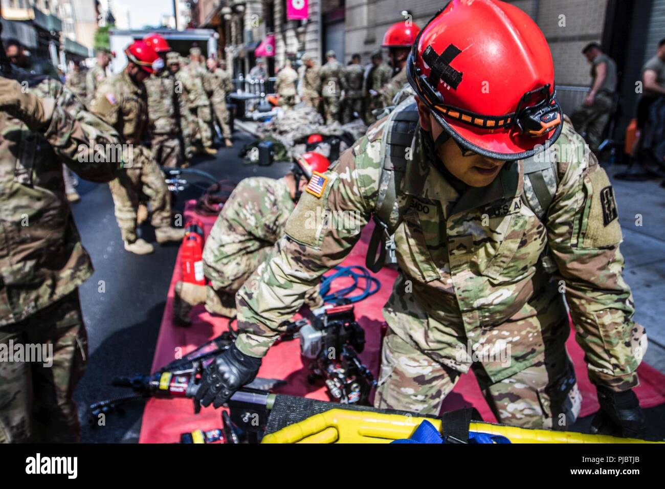 Army Reserve Spc. Jason Delgado, 328th Combat Support Hospital, practices lifesaving skills in Manhattan, New York, July, 10, 2018. These soldiers are part of a national response element that works with civil authorites to provide manpower, vehicles, and equipment to perform medical services as well as chemical, biological, and radiological clean up — skills that would be in high demand in the event of a disaster or attack. Stock Photo