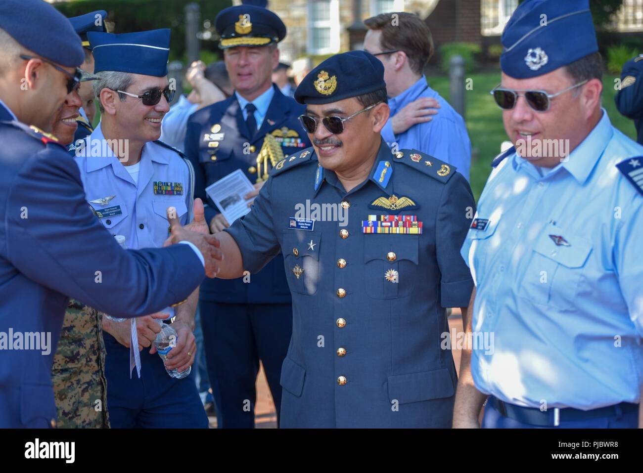 Foreign military officers arrive at the Joint Base Anacostia-Bolling Parade as the base celebrates its 100th Anniversary Jul 3, 2018. Bolling Field was officially dedicated on 1 July, 1918, after the property was purchased by the War Department and turned over to the Aviation Section of the Signal Corps to serve as the primary aviation facility for the capital city. This new military property was appropriately named for Colonel Raynal C. Bolling, an early vanguard in the quest for Army airmanship. Stock Photo