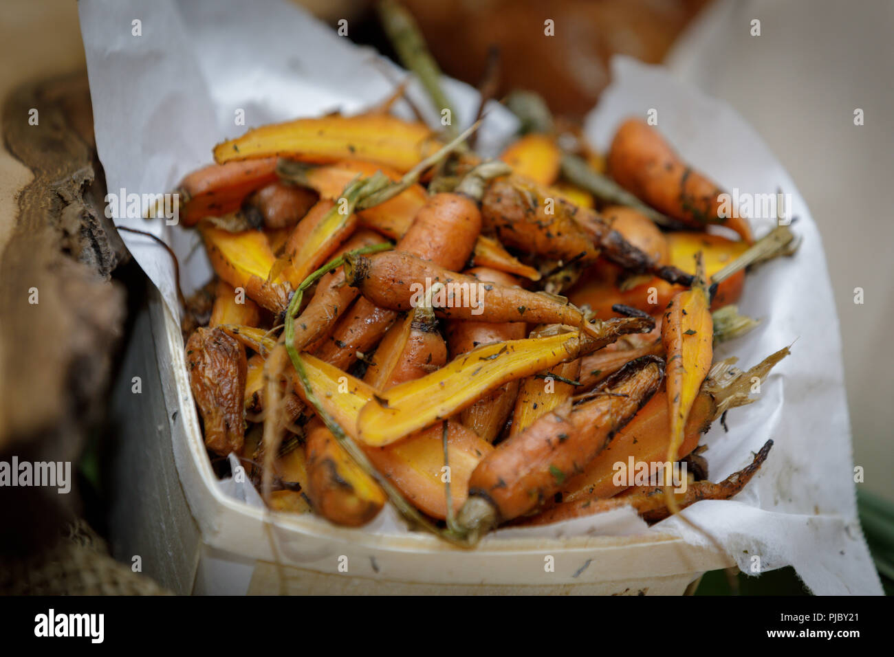 Gourmet roasted carrots cooked with herbs Stock Photo