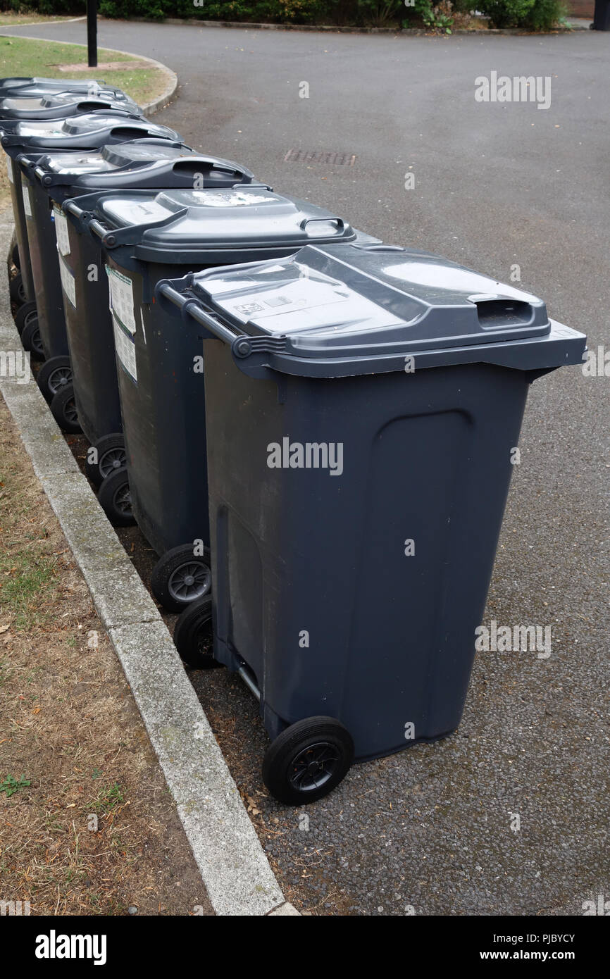 Row of 6 neatly arranged wheelie bins in Bawtry, Doncaster Stock Photo