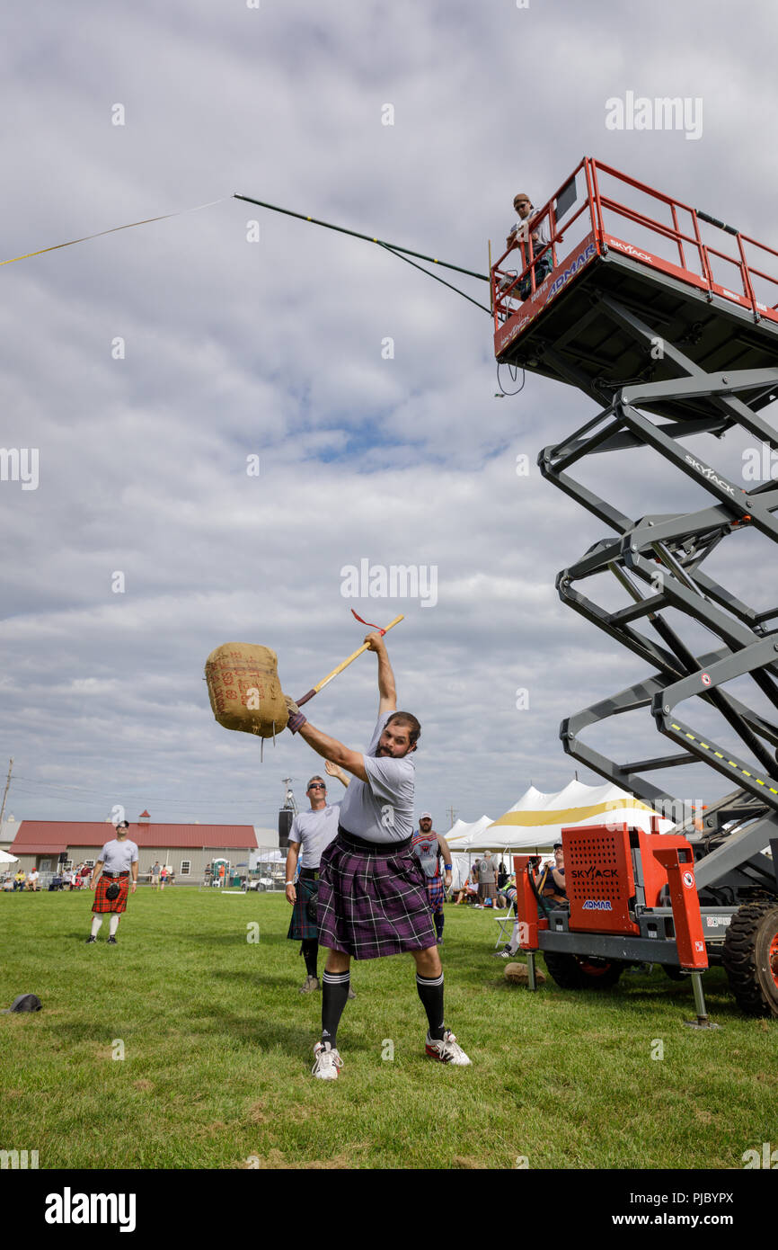 Man competes in the sheaf toss at the annual Capital District Scottish