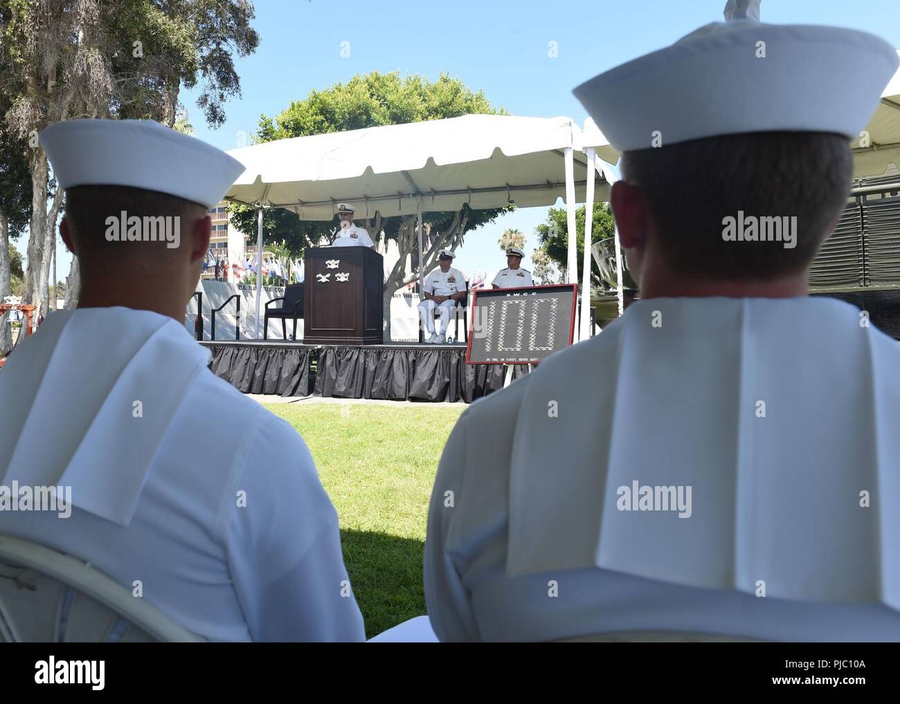 SAN DIEGO (July 19, 2018) - Cmdr. Matthew Russell, commanding officer of Special Boat Team (SBT) 20 delivers a speech to recent graduates of Special Warfare Combatant-Craft Crewman (SWCC) Class 100. Following a 37-week training course, these students will now join various Naval Special Warfare commands to begin their careers as special operations craft operators. Stock Photo