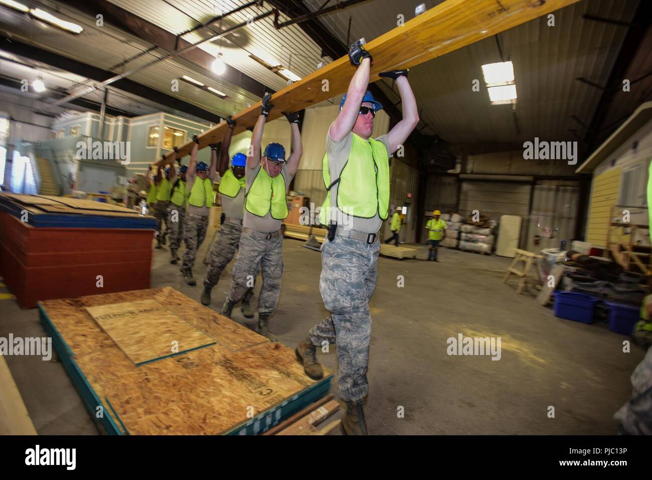 More than 40 U.S. Airmen from the South Carolina Air National Guard’s 169th Civil Engineer Squadron spent their annual training constructing homes for Native American veterans in Gallup, New Mexico, July 11, 2018. The “Deployment for Training” mission partnered military engineers with the Southwest Indian Foundation to construct homes from start to finish. Stock Photo