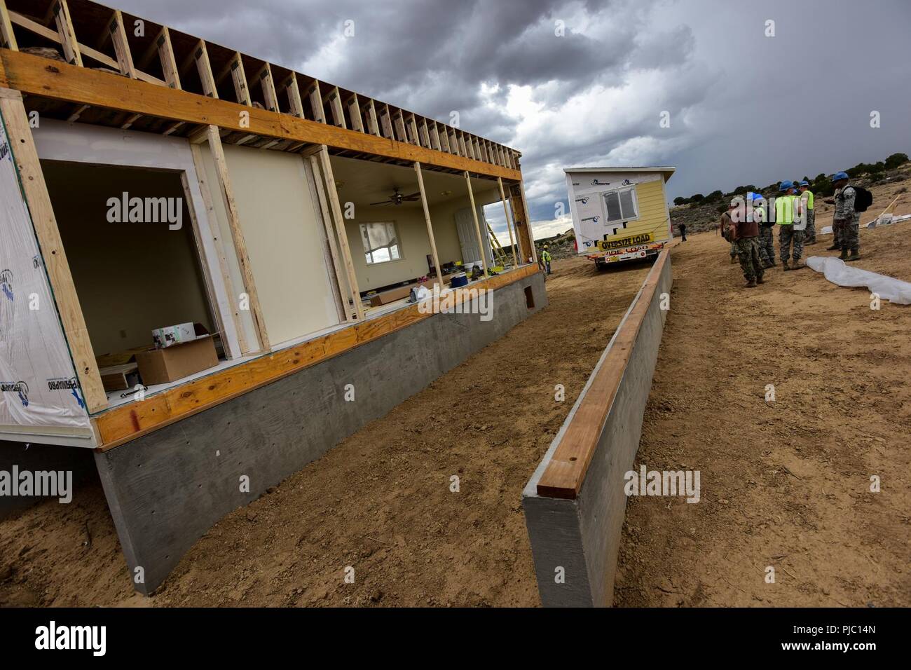 U.S. Airmen from the 169th Civil Engineer Squadron, construct homes for Native American veterans during the “Deployment for Training” mission to Gallup, New Mexico, July 12, 2018. Airmen assigned to the South Carolina Air National Guard's 169th Fighter Wing partnered with the Southwest Indian Foundation to provide all phases of the construction process including carpentry, framing, electrical, plumbing and site work. Stock Photo