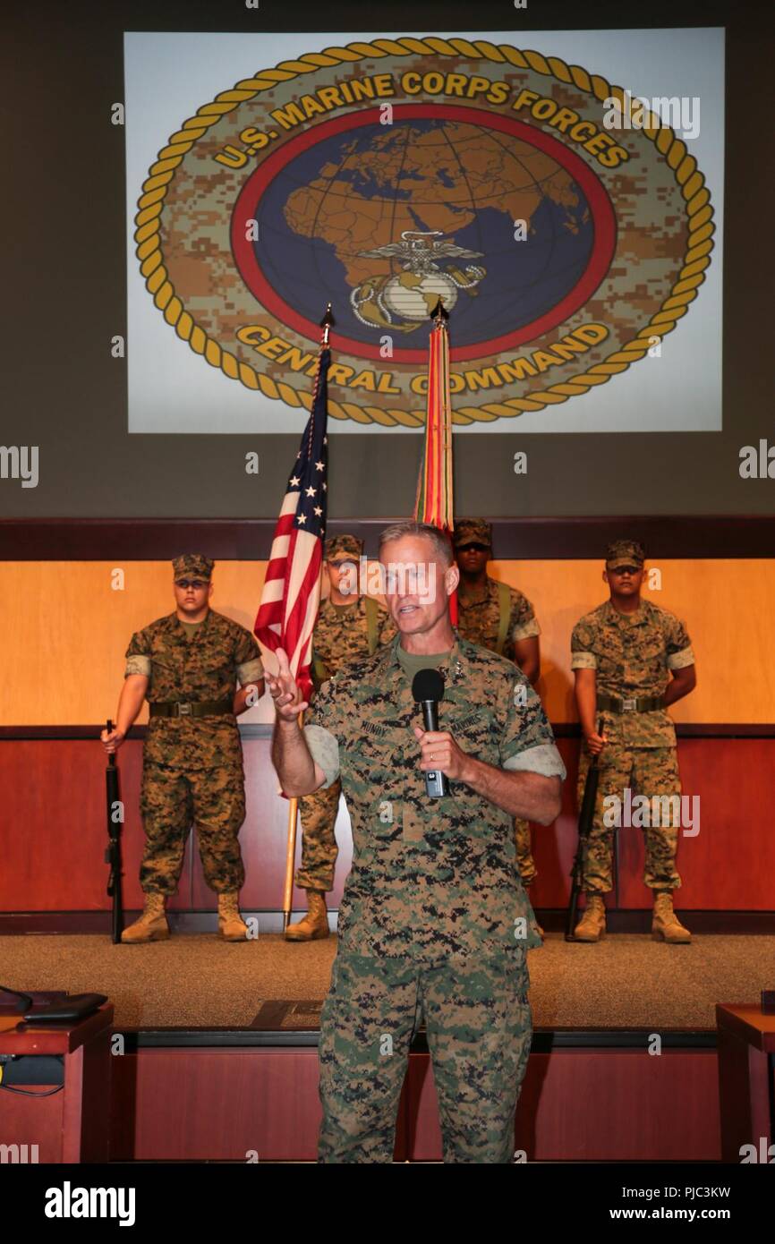 Lieutenant General Carl E. Mundy, III, the new commander of United States Marine Corps Forces, Central Command addresses the service members and attendees during the MARCENT change of command ceremony, at the  Vince Tolbert Building at MacDill Air Force Base, July 11. Mundy assumed command from Lt. Gen. William D. Beydler, who has served as the MARCENT Commander since Oct. 27, 2015. Stock Photo