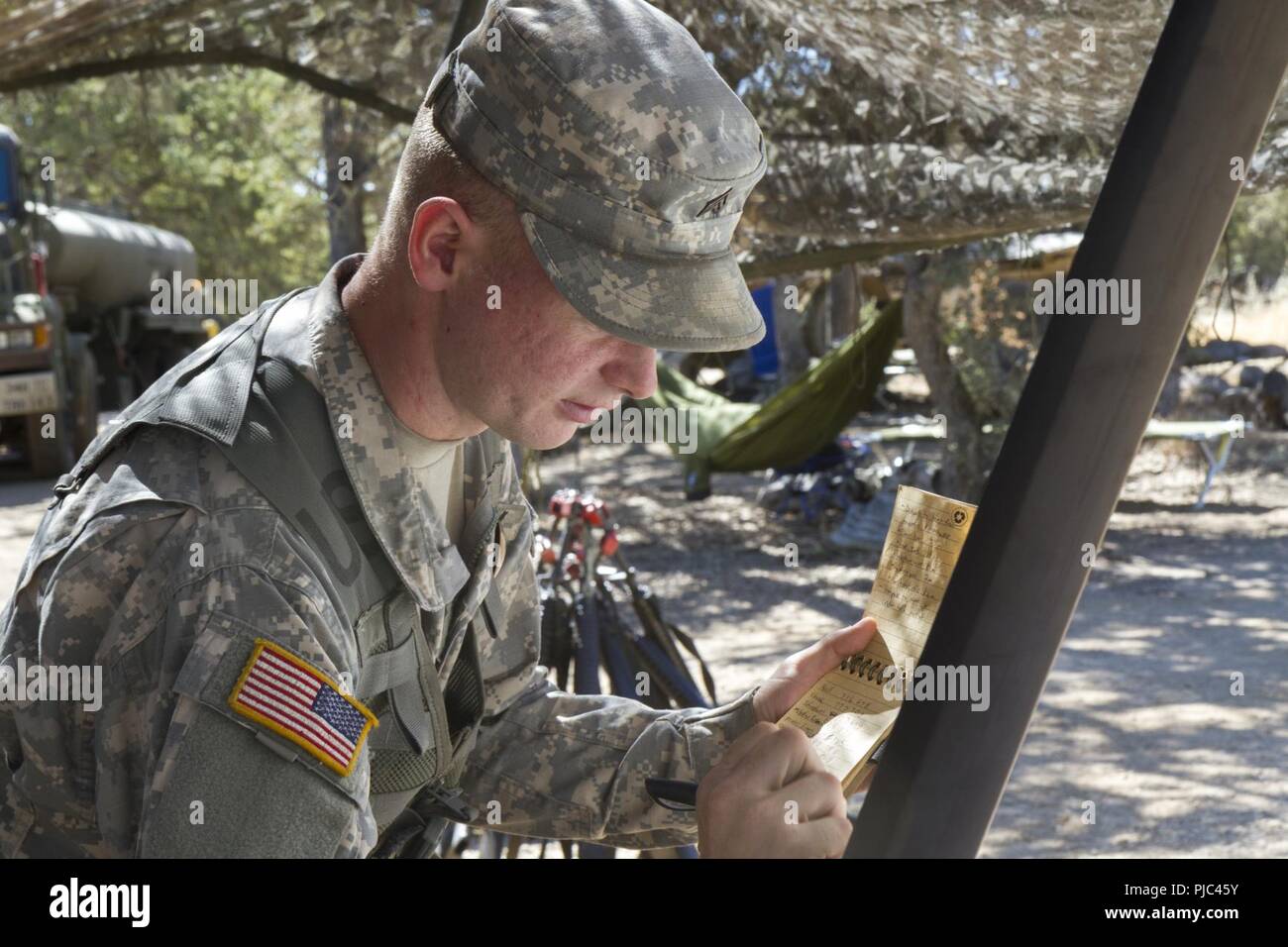 FORT HUNTER LIGGETT-- U.S. Army Sgt. Tobias Ropp of the 348th Transportation Company records key information whi teaching a land navigation course during the 91st Training Division's Combat Support Training Exercise (CSTX 91-18-01) on July 11, 2018 in Ft. Hunter Liggett, California. The CSTX 91-18-01 ensures America’s Army Reserve units are trained to deploy bringing capable, combat-ready, and lethal firepower in support of the Army and our joint partners anywhere in the world. Stock Photo