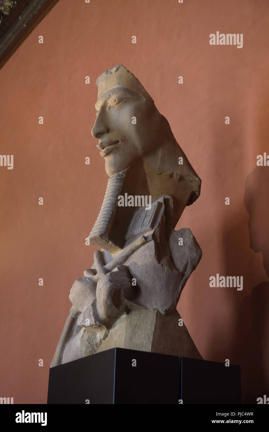 Colossal statue of Pharaoh Akhenaten in the Amarna style (ca. 1350 BC) on display in the Louvre Museum in Paris, France. Stock Photo