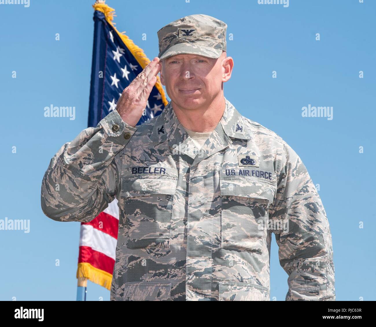 U.S. Air Force Col. Victor Beeler, 60th Mission Support Group commander receives his first salute during the Change of Command ceremony at Travis Air Force Base, Calif., July 16, 2018. Col. Ethan Griffin, 60th Air Mobility Wing commander was the presiding officer for the Change of Command Ceremony. Stock Photo