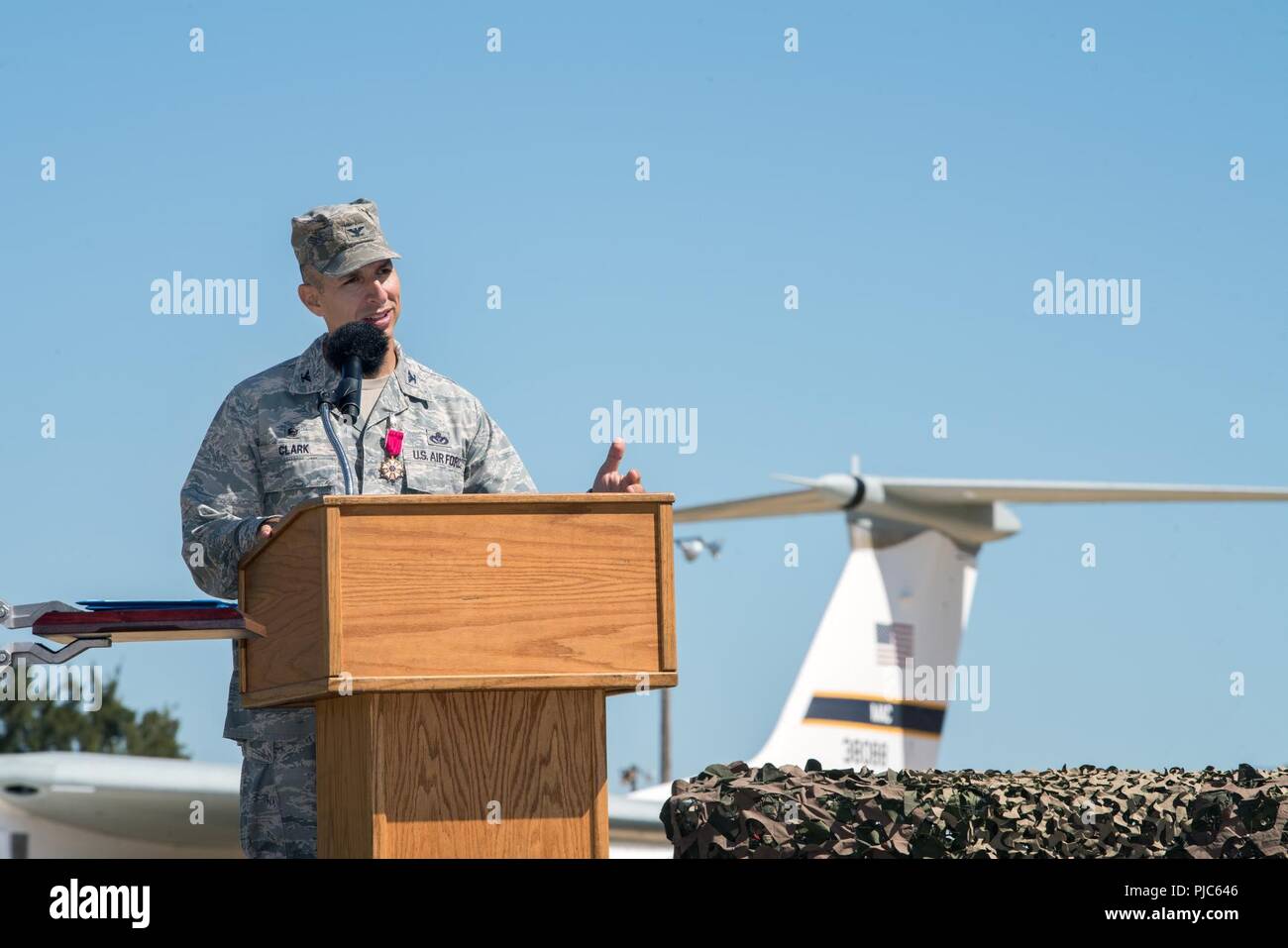 U.S. Air Force Col. Lance Clark, 60th Mission Support Group commander provides remarks during the Change of Command ceremony at Travis Air Force Base, Calif., July 16, 2018. Col. Ethan Griffin, 60th Air Mobility Wing commander was the presiding officer for the Change of Command Ceremony. Stock Photo