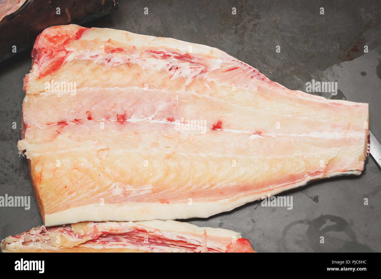 Pintado fish fillet. Brazilian Pintado fish, white meat, leather fish with rounded black spots on the body. Stock Photo