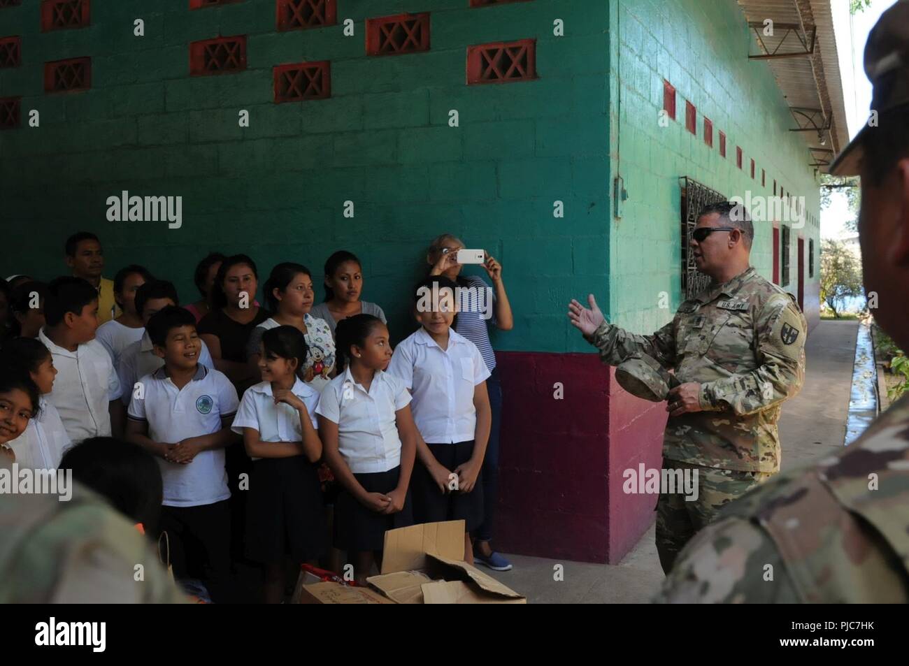 Sgt. Maj. William Lopez from the Puerto Rican National Guard Joint Force Headquarters serving as the Command Sergeant Major for the Combined Joint Task Force-Hope in El Salvador, speaks to the students of the El Amate community after Soldiers from the 413th Civil Affairs Battalion delivered donated goods from Puerto Rico during the Beyond the Horizon 2018 exercise. Beyond the Horizon 2018, (BTH) is an exercise deploying active Army, National Guard and Reserve Soldiers. These are two-week rotations for Soldiers to work with the El Salvadoran military and civic agencies bringing vital services a Stock Photo