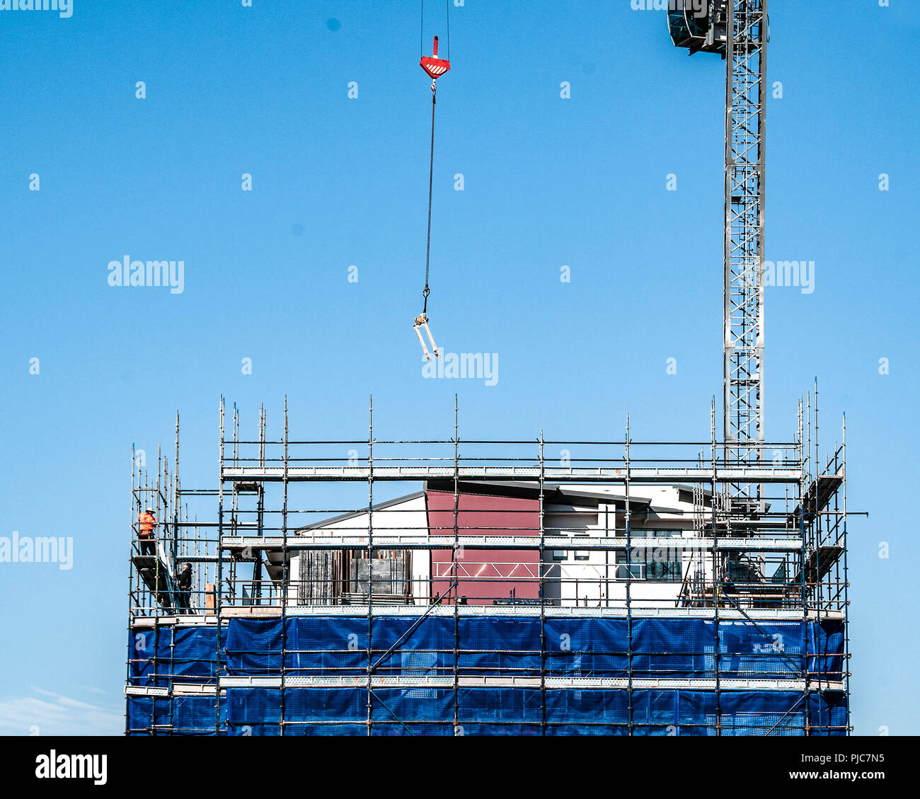 Gosford, New South Wales, Australia - August 3. 2018: Construction site and building progress update 113.  Rigging scaffolding on new home units build Stock Photo
