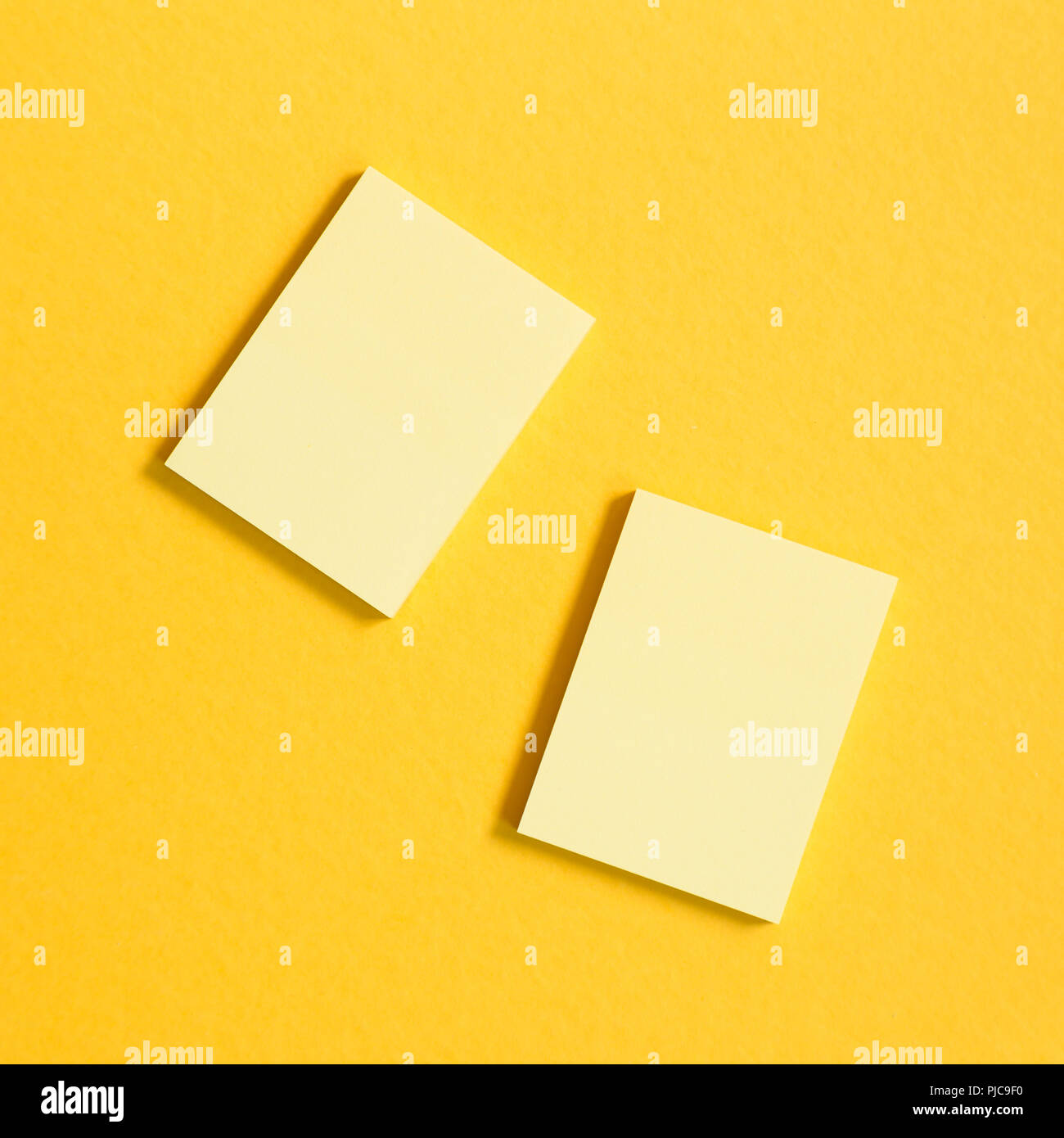 Yellow memo pad, sticky notes on yellow background Stock Photo Alamy