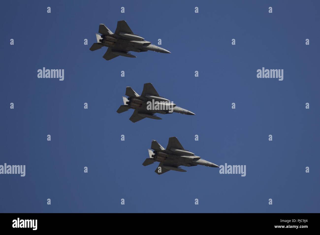 Three F-15C Eagle fighter jets from the 144th Fighter Wing, California Air National Guard, fly over Joint Forces Training Base, Los Alamitos, California, during the installation's annual July 4 Fireworks Spectacular community event, July 4, 2018. The aircraft landed at the base after conducting a flyover of Dodger Stadium in Los Angeles to kick off the Dodgers' July 4th baseball game. Stock Photo