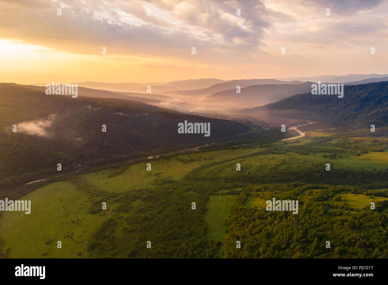 aerial view of carpathian mountains on sunset. magic mist Stock Photo ...