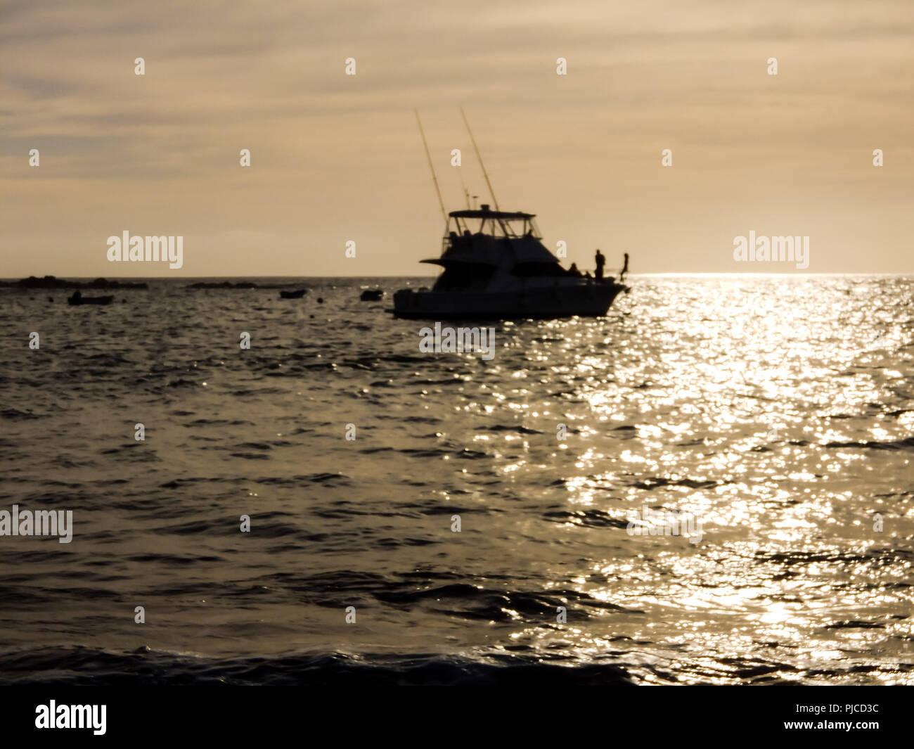 Photo Picture of a Boat Silhouette at Sunset Stock Photo - Alamy