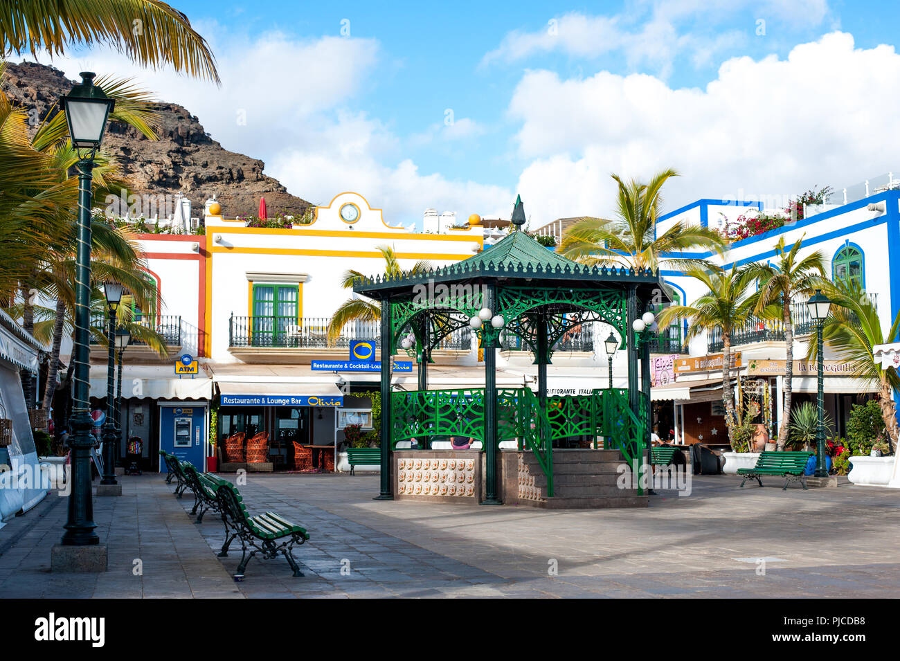 Puerto de Mogan, Gran Canaria, Spain - 06 January 2018, Quayside plaza with nice pavilion in the center square in  Puerto de Mogan, Stock Photo