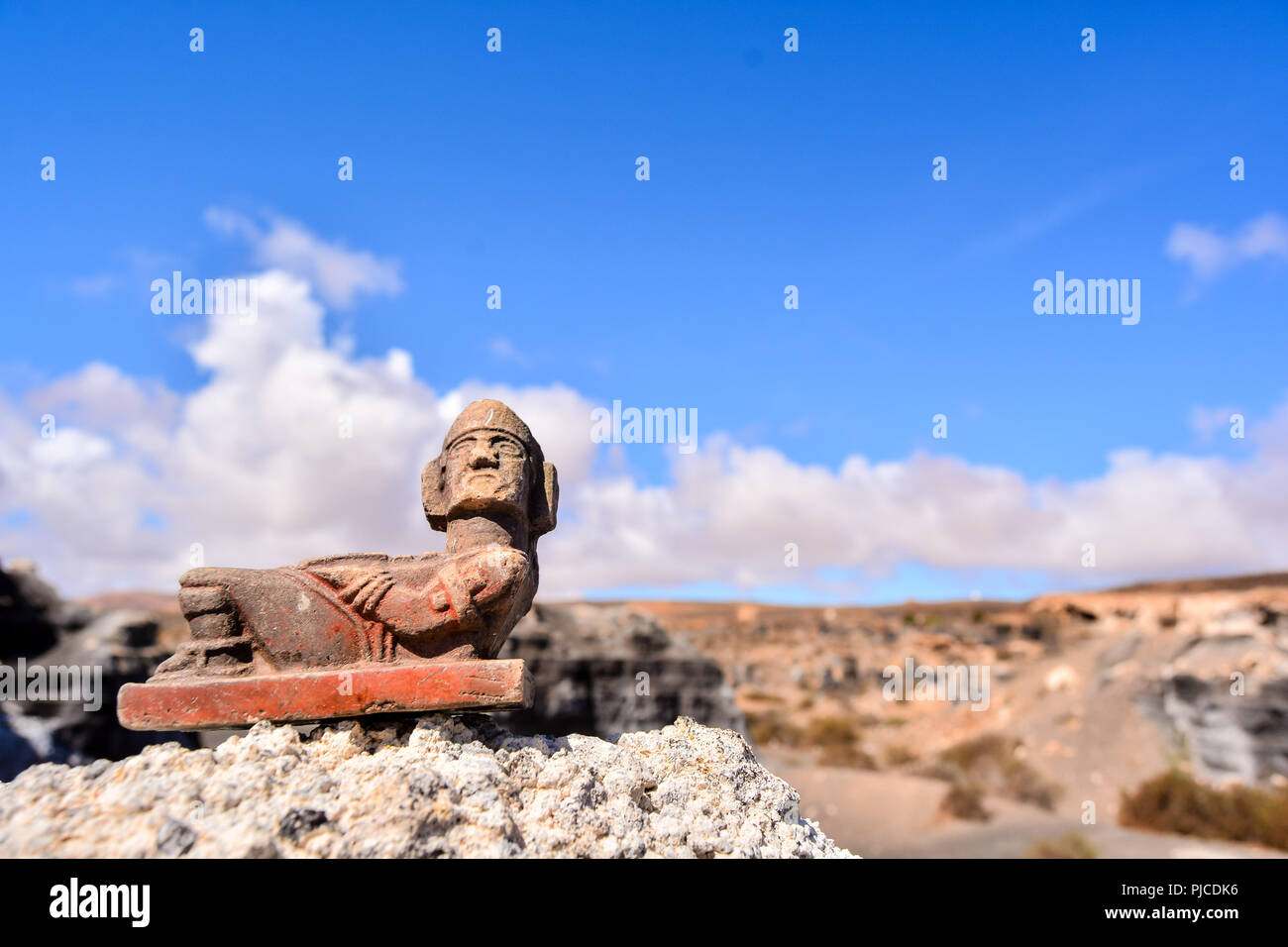 Conceptual Photo Picture of a Mayan Statue in the dry desert Stock Photo