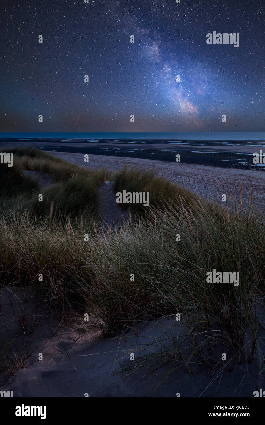 Stunning vibrant Milky Way composite image over landscape of Summer ...